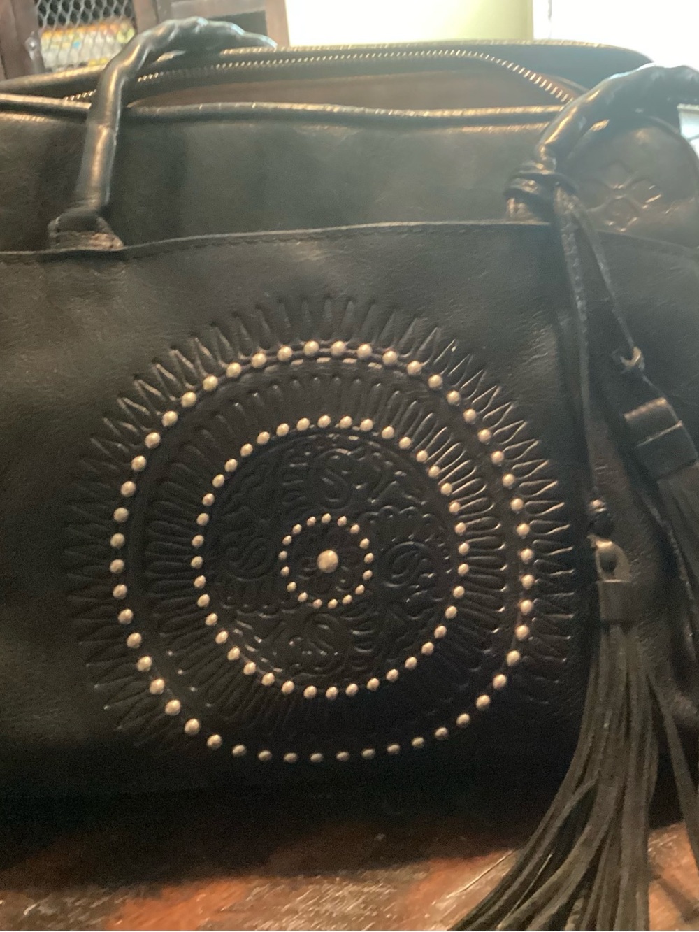 Patricia Nash Black Leather Shoulder Bag with Embossed Medallion & Tassel